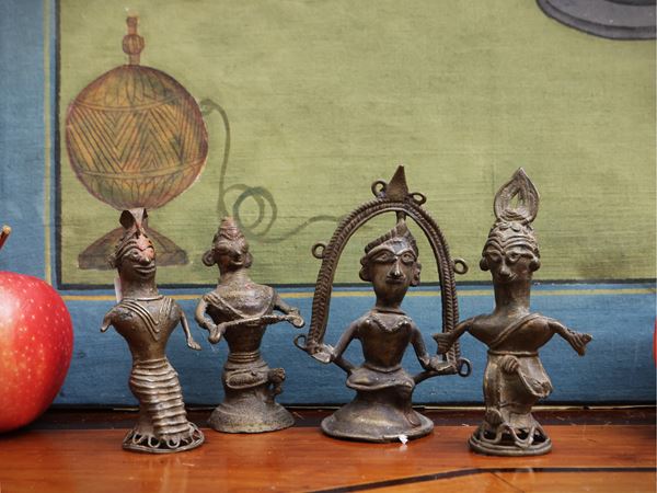 Four small bronze figures