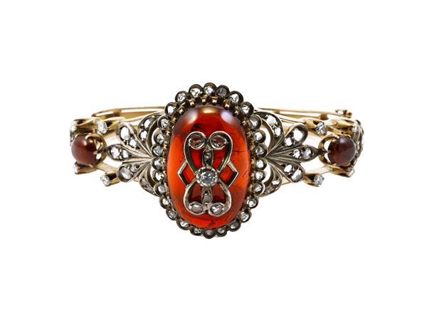 Yellow gold and silver rigid bracelet with amber and diamonds