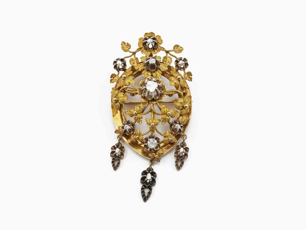 Spilla in oro giallo e argento con diamanti