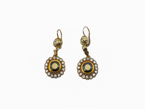 Yellow gold and silver pendant earrings with diamonds and sapphires