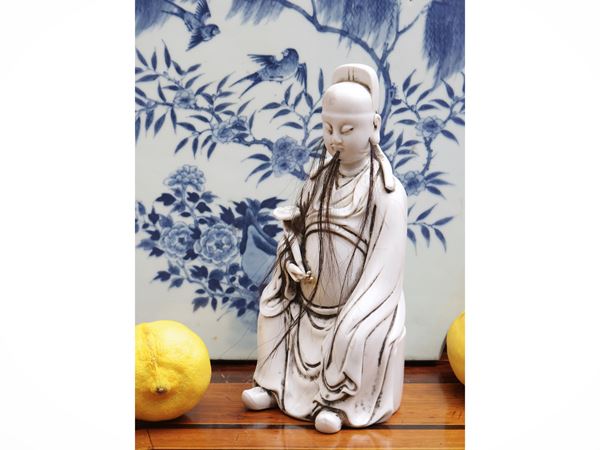Figura in porcellana “blanc de Chine” raffigurante Wenchang Xingjun, Cina