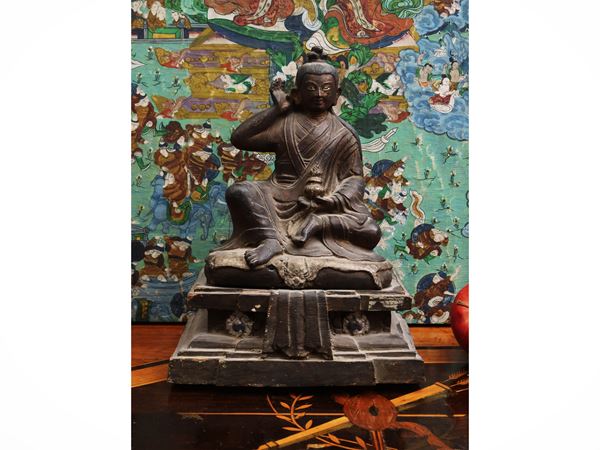 Wooden sculpture depicting the Tibetan mystic Milarepa