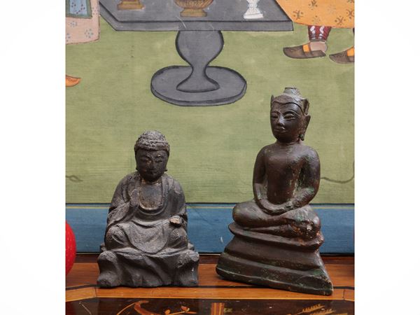 Two sculptures depicting the seated Buddha