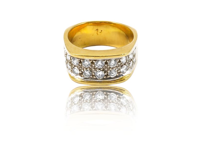 Anello a fascia in oro giallo e bianco con diamanti