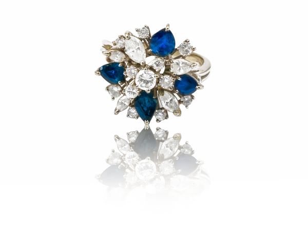 White gold ring with diamonds and sapphires