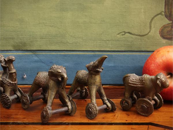 Seven small votive metal sculptures