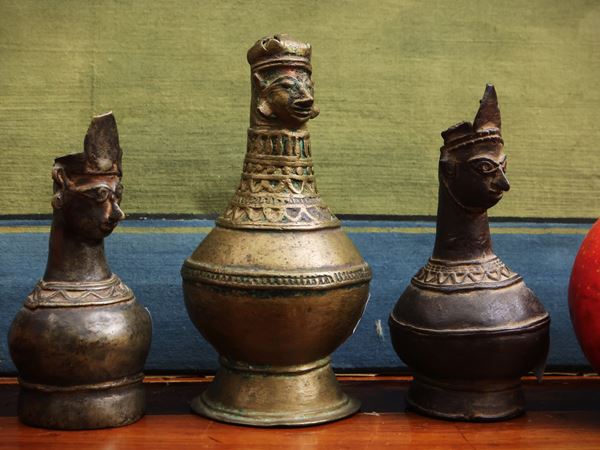 Three small anthropomorphic bronze vases
