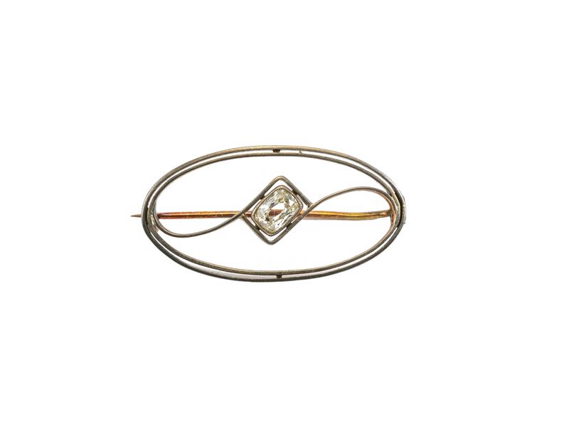 Spilla in oro giallo e argento con diamante