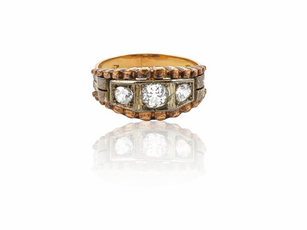 A 18k red gold, platinum and diamonds trilogy ring