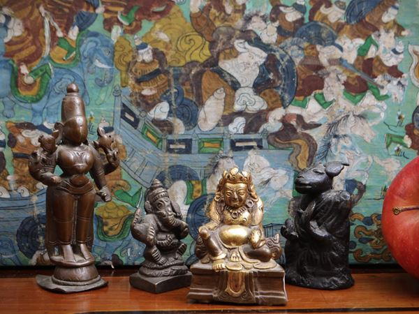 Four small bronze figures