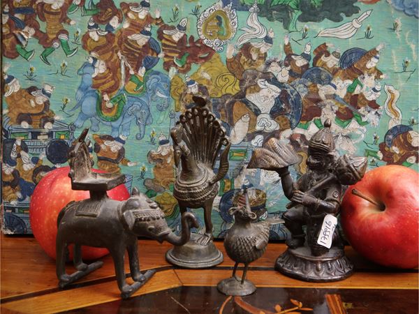 Four small bronze votive figures