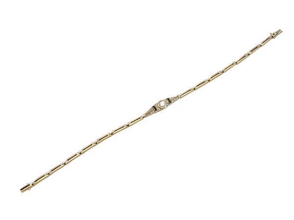 Bracciale in oro giallo e platino con diamanti e onice