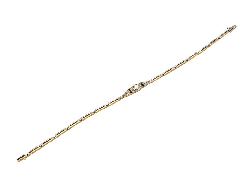 Bracciale in oro giallo e platino con diamanti e onice