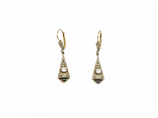 Yellow gold and platinum pendant earrings with diamonds