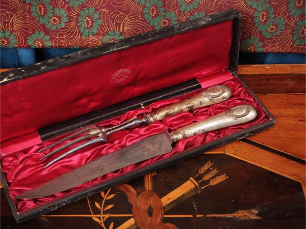 Pair of serving cutlery with silver-coated handle