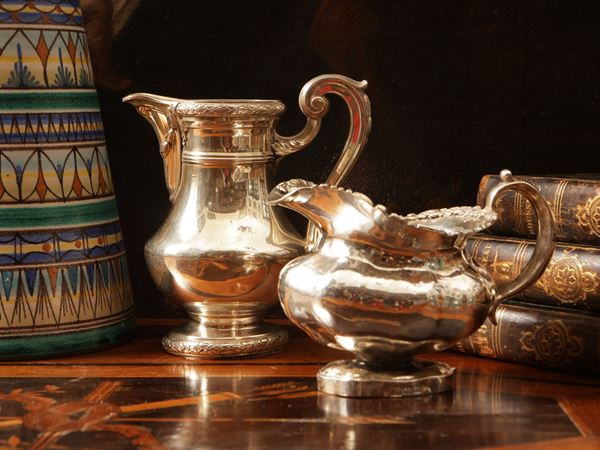 Two vintage collectible milk jugs