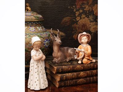 Royal Copenaghen, Cervo accucciato; B&G, Bambina con bambola; Porcellana, tre soprammobili da col...