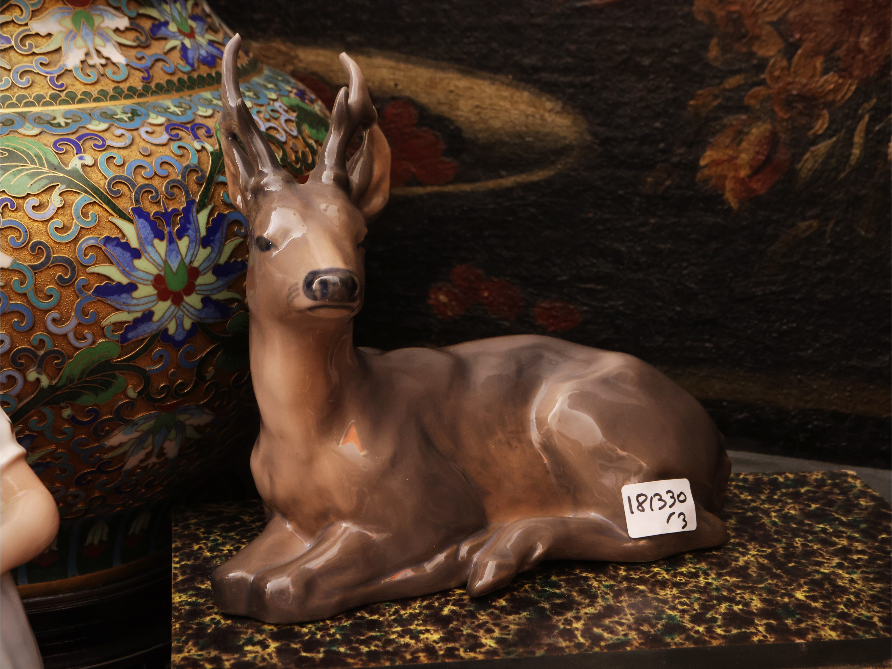 Royal Copenaghen, Cervo accucciato; B&G, Bambina con bambola; Porcellana, tre soprammobili da col...