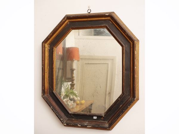 Mirror in lacquered and gilded wood