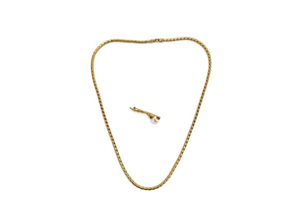 Collana e spilla in metallo golden tone