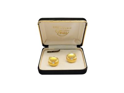 Gemelli in metallo dorato con strass centrale