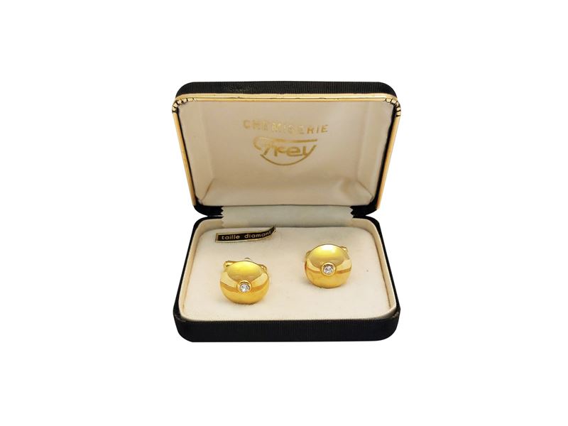 Gemelli in metallo dorato con strass centrale