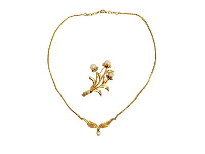 Collana e spilla in metallo golden tone, motivo a foglio con perla simulata