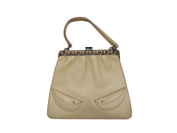 Sand-colored leather handbag
