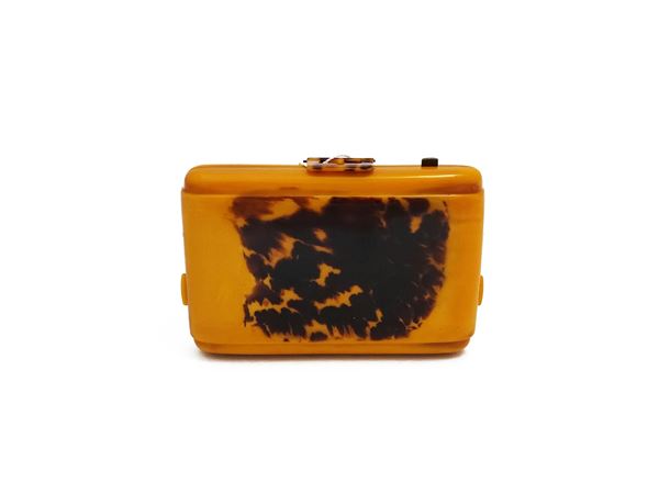 Trousse in bachelite color ambra