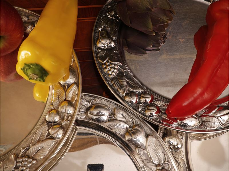 Serie di dodici sottopiatti in argento, Braganti Firenze