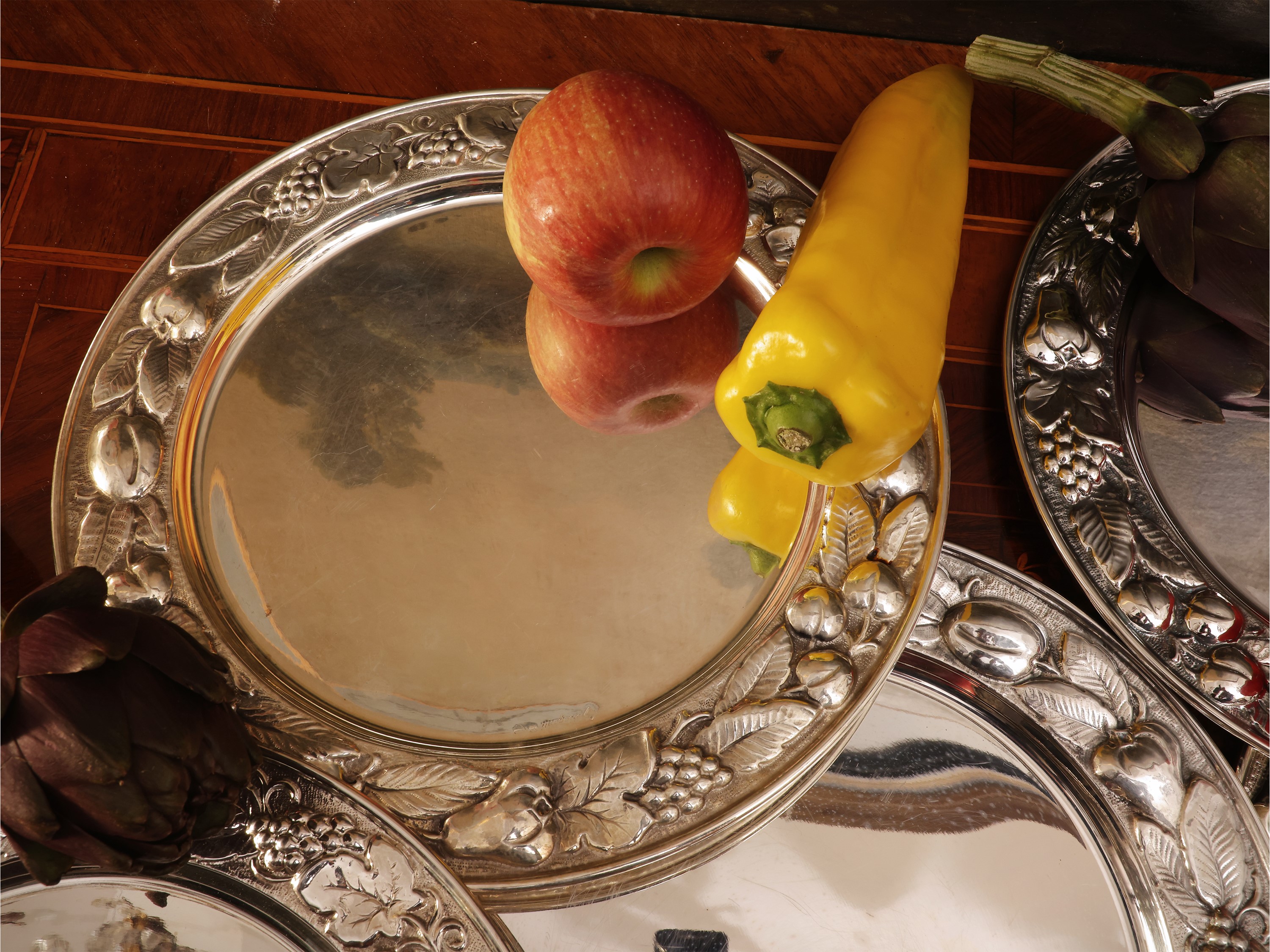 Serie di dodici sottopiatti in argento, Braganti Firenze