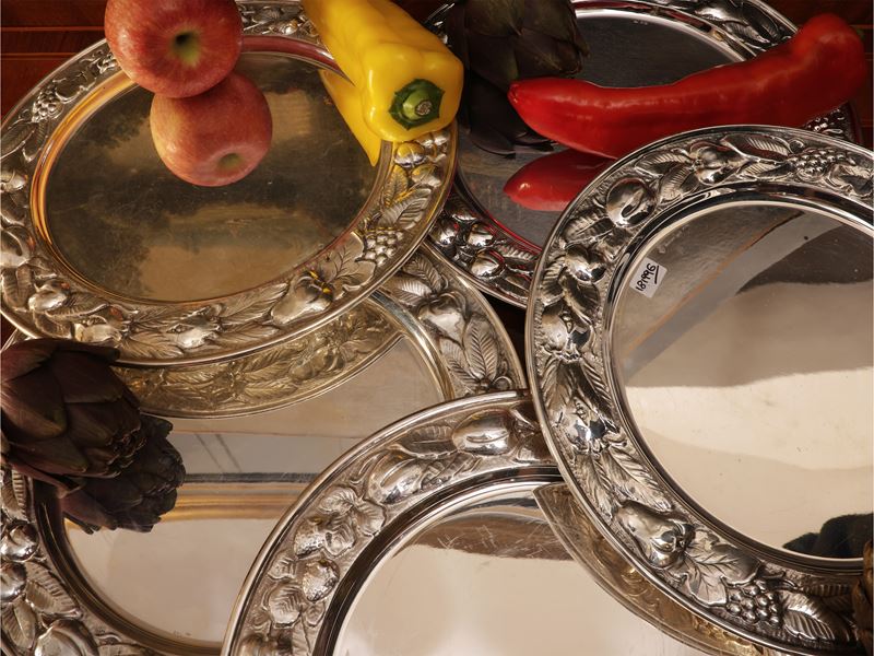 Serie di undici sottopiatti in argento, Braganti Firenze