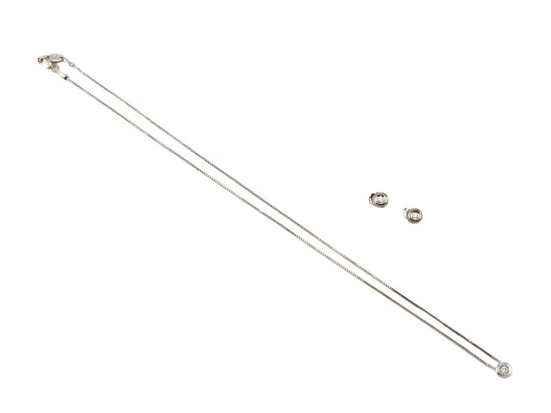 Demi parure in oro bianco e diamanti