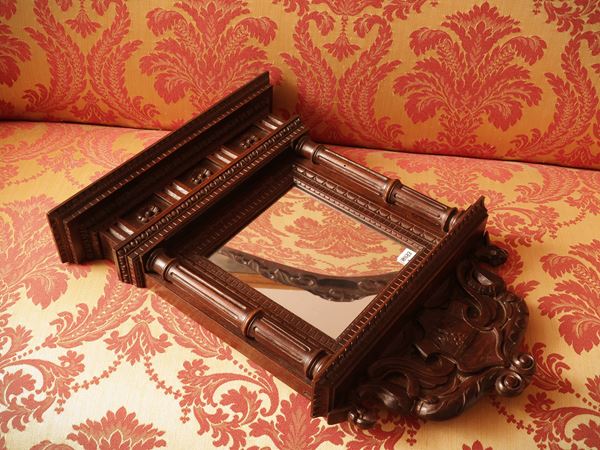 Small mirror with walnut frame