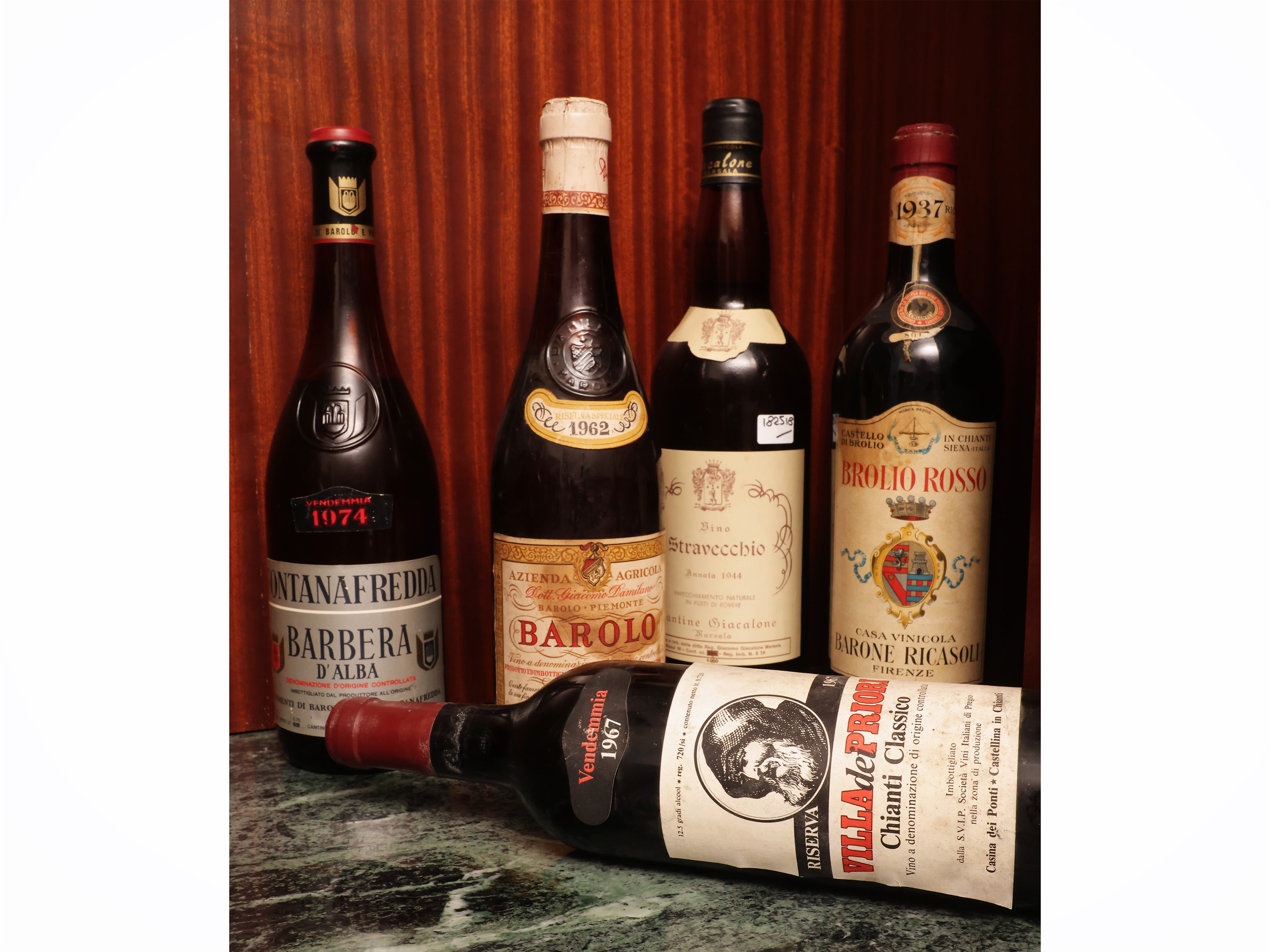 Lotto di vini e liquori: Chianti DOCG Brolio Rosso, Barolo 1973, Barolo 1962 e Barbera d'Alba 197...