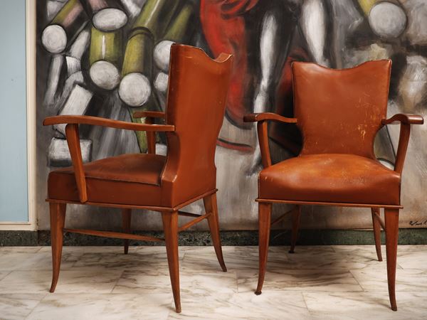 Series of three armchairs in beech and leather