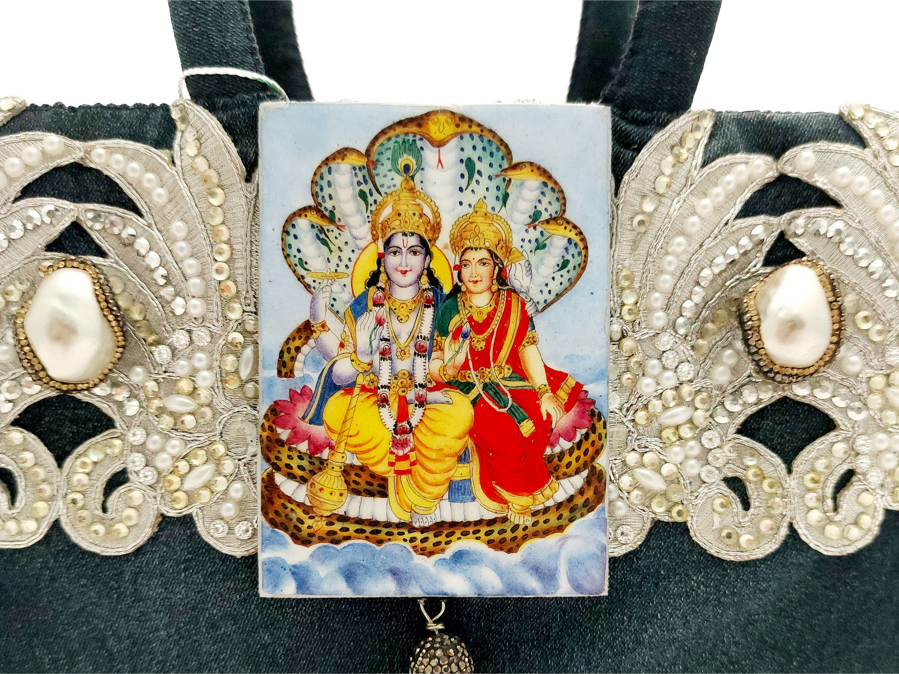 Borsa gioiello blu con ricamo argento