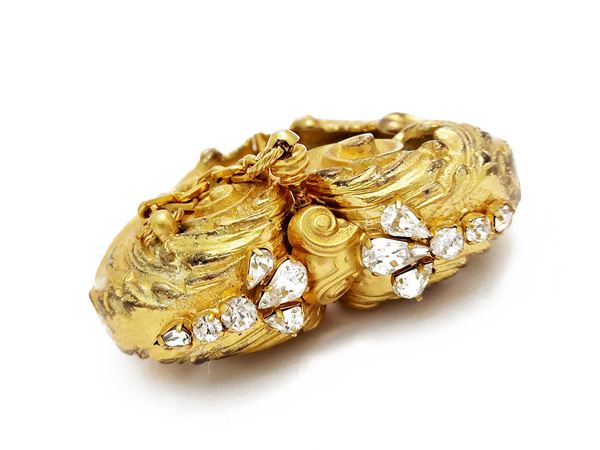 Importante bracciale rigido in metallo dorato