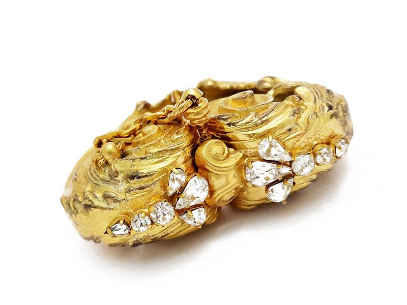 Importante bracciale rigido in metallo dorato