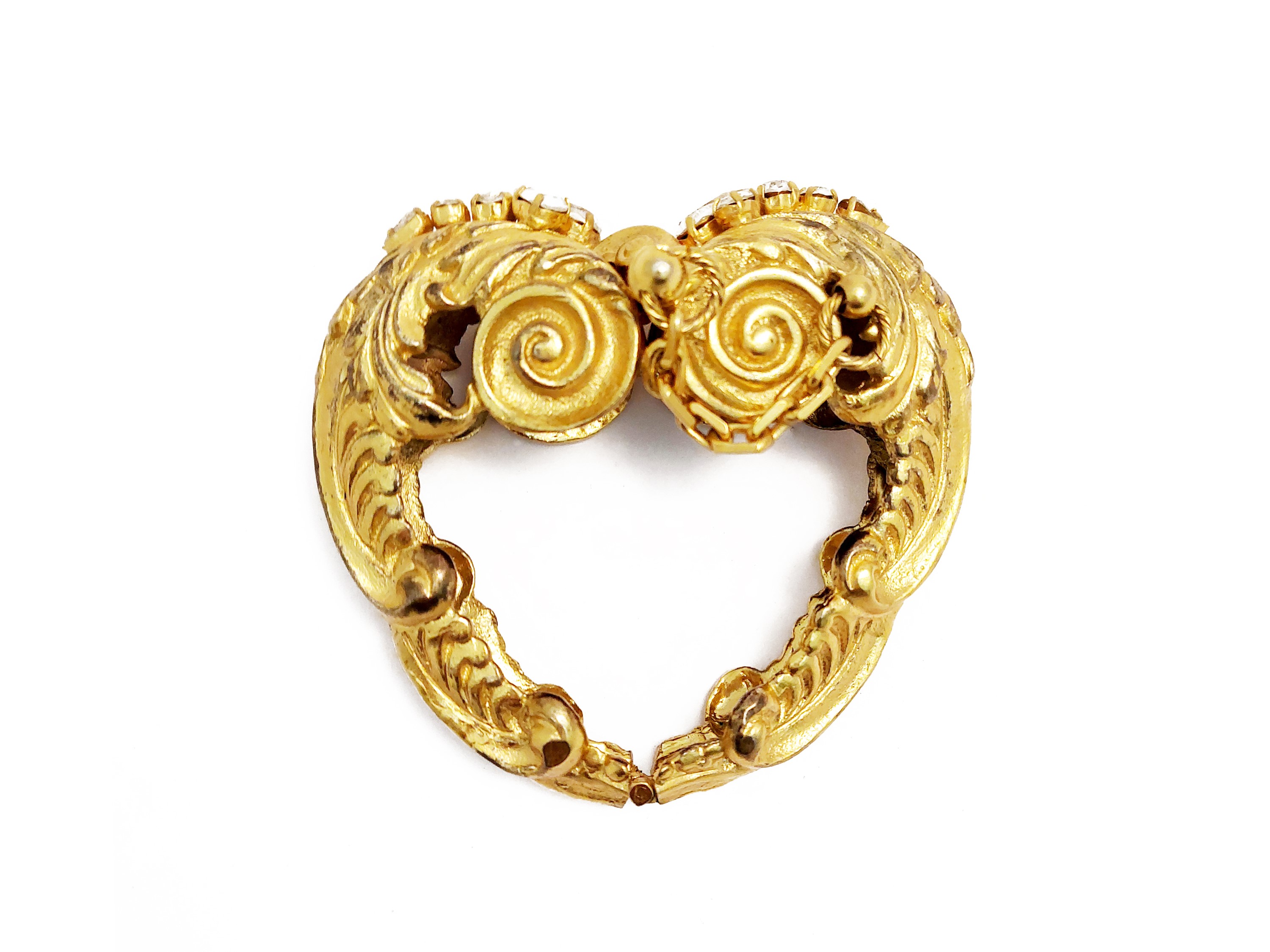 Importante bracciale rigido in metallo dorato