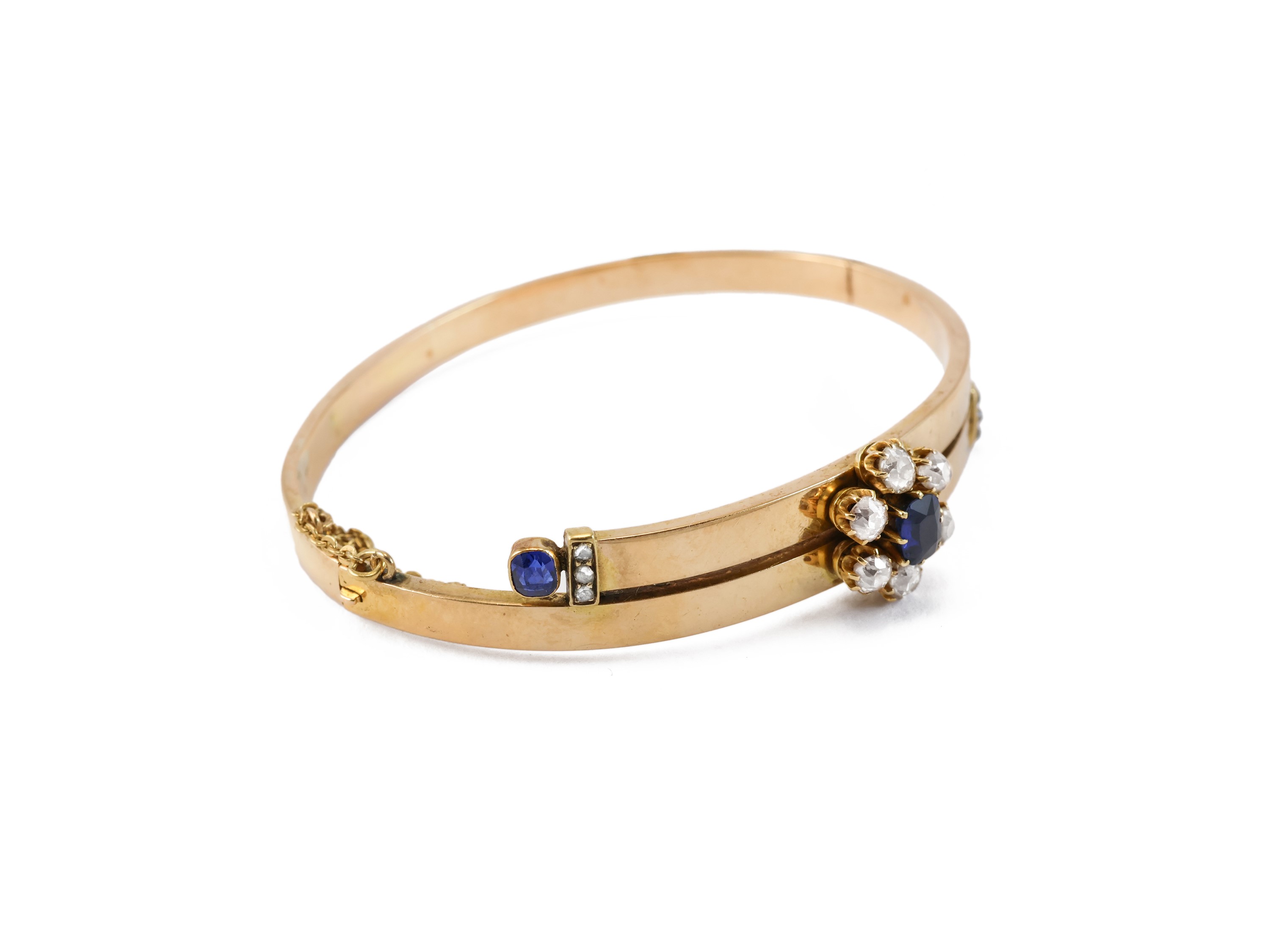 Bracciale a cerchio rigido in oro giallo, zaffiri e diamanti
