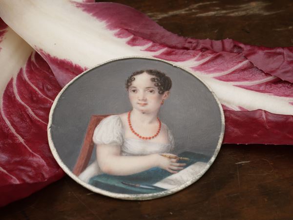 Scuola italiana dell'inizio del XIX secolo - Portrait of a girl intent on writing with coral jewels