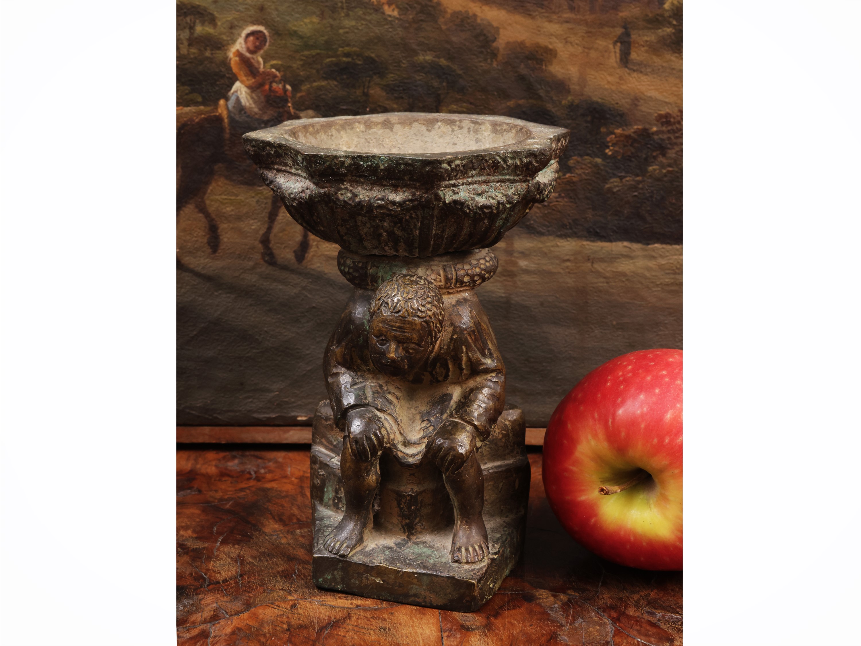 Piccola acquasantiera in bronzo, figura maschile con coppa