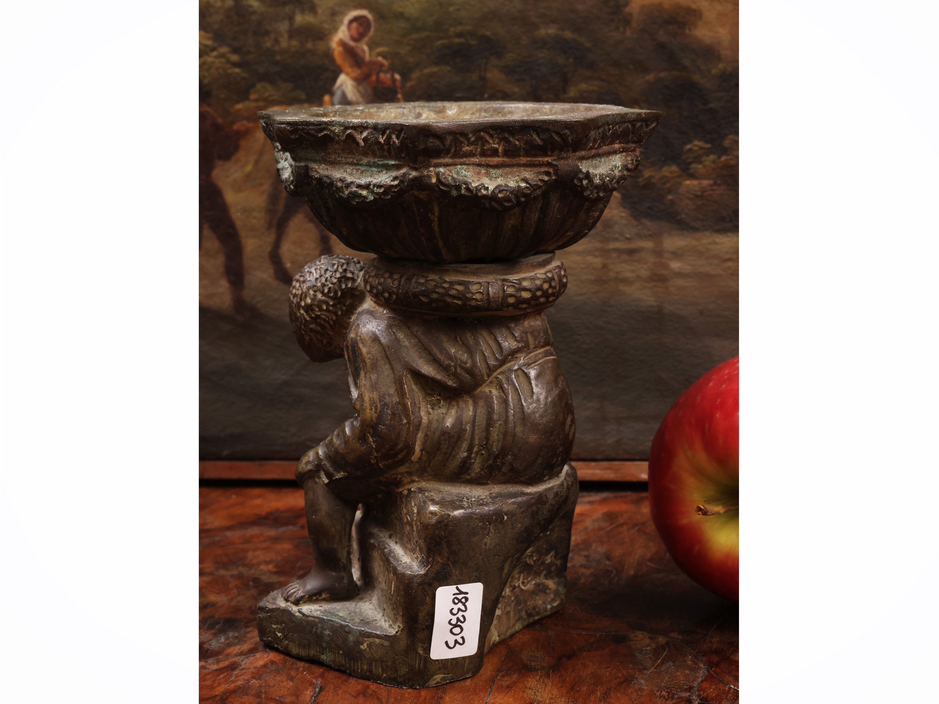 Piccola acquasantiera in bronzo, figura maschile con coppa