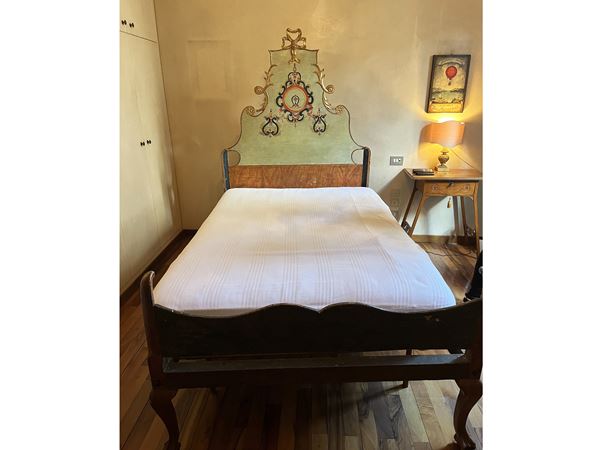 Bed in aqua green lacquered wood