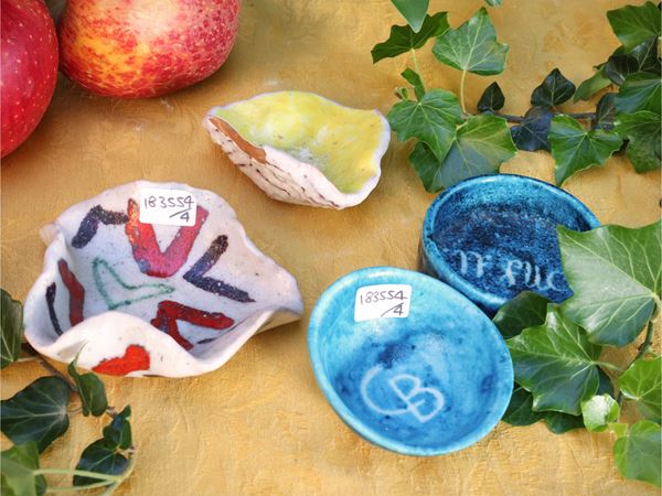 Four small glazed ceramic bowls