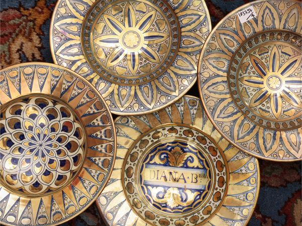 Four luster-glazed terracotta plates, Cantagalli
