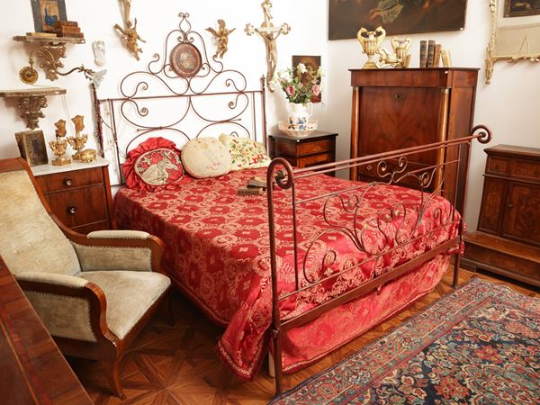 Double bed in red lacquered wrought iron
