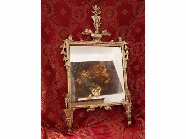 Small mirror in carved and gilded wood