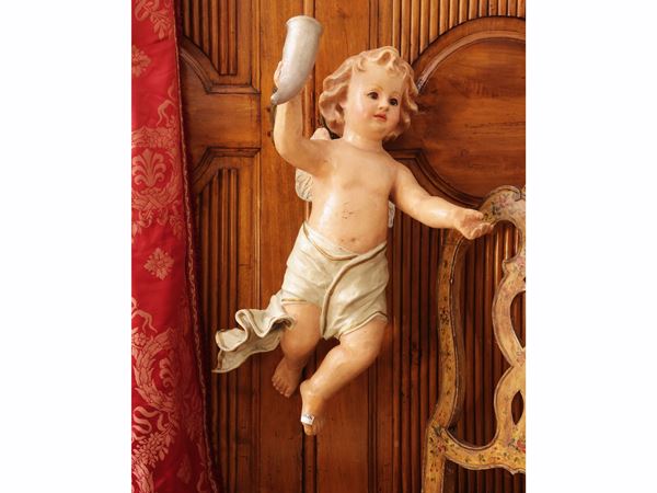 Putto in polychrome papier-mâché